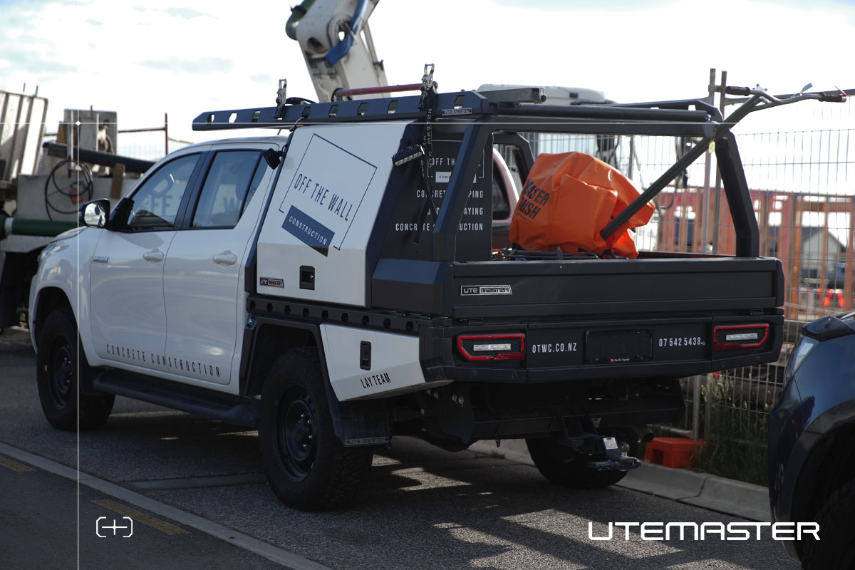 Off The Wall Construction Toyota Hilux with Utemaster TrailCore tray and canopy on a construction site